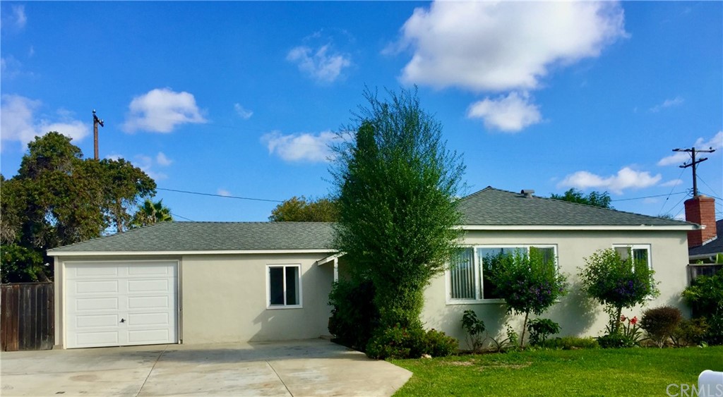 970 Linden Place Costa Mesa, CA 92627 - Photo 2 of 9 front view of a house with a yard