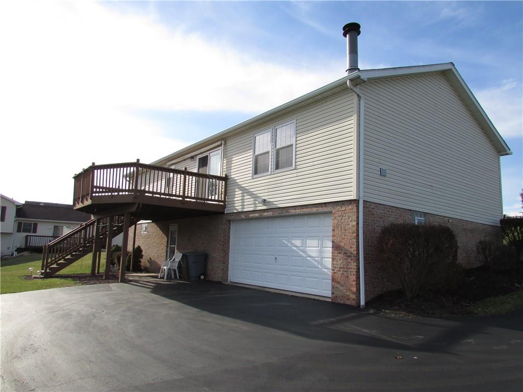 Back of house.  Large deck and 2 car oversized garage.
