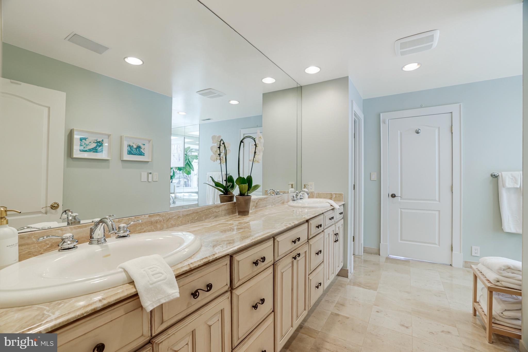 1127 Bellview Road McLean, VA 22102 - Photo 29 of 67 a bathroom with a double vanity sink and a mirror