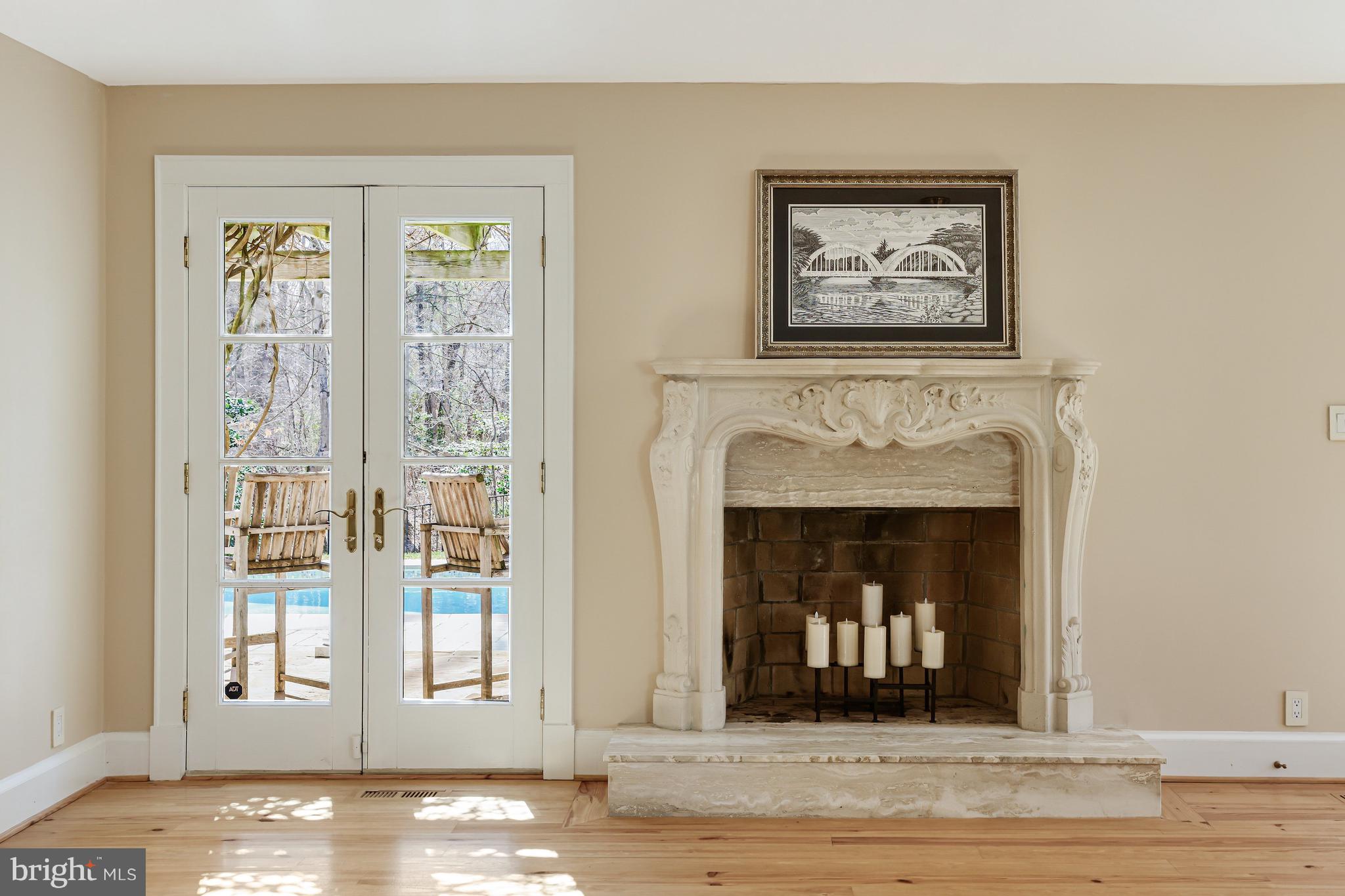 1127 Bellview Road McLean, VA 22102 - Photo 33 of 67 a living room with furniture and a fireplace