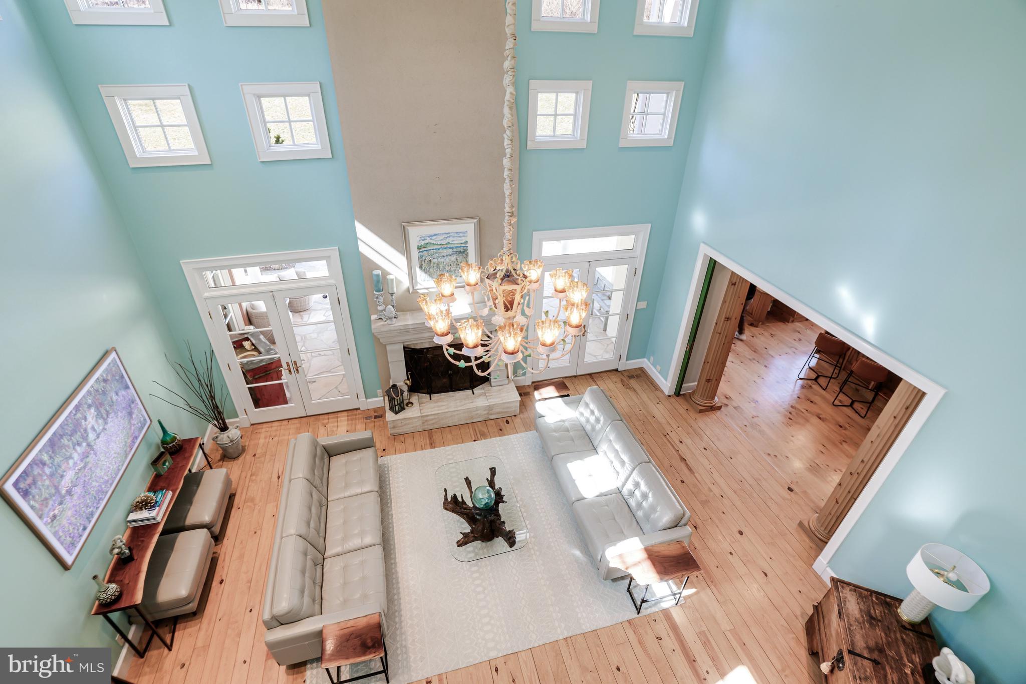 1127 Bellview Road McLean, VA 22102 - Photo 41 of 67 a view of living room filled with furniture and a chandelier
