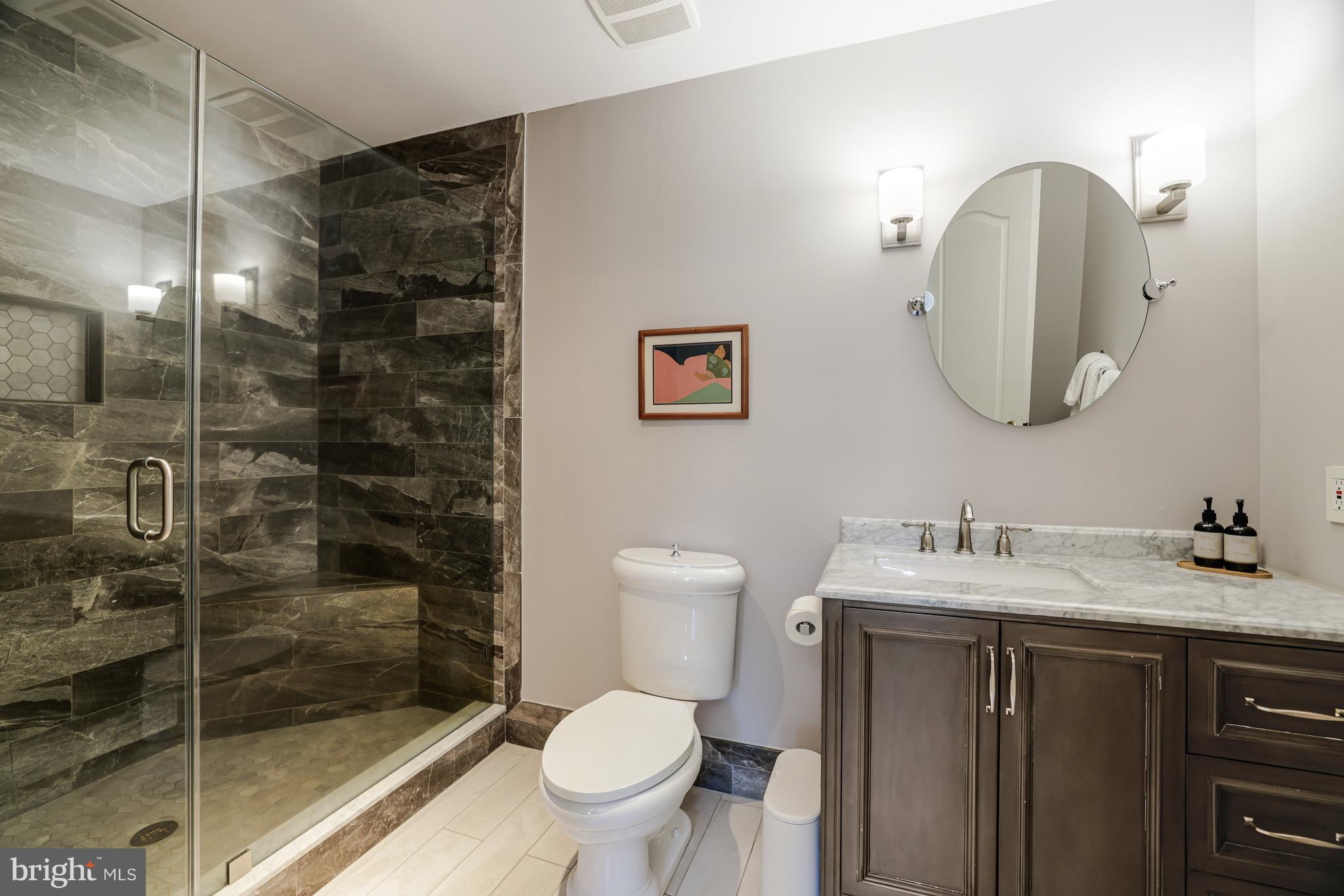 1127 Bellview Road McLean, VA 22102 - Photo 43 of 67 a bathroom with a toilet sink and shower