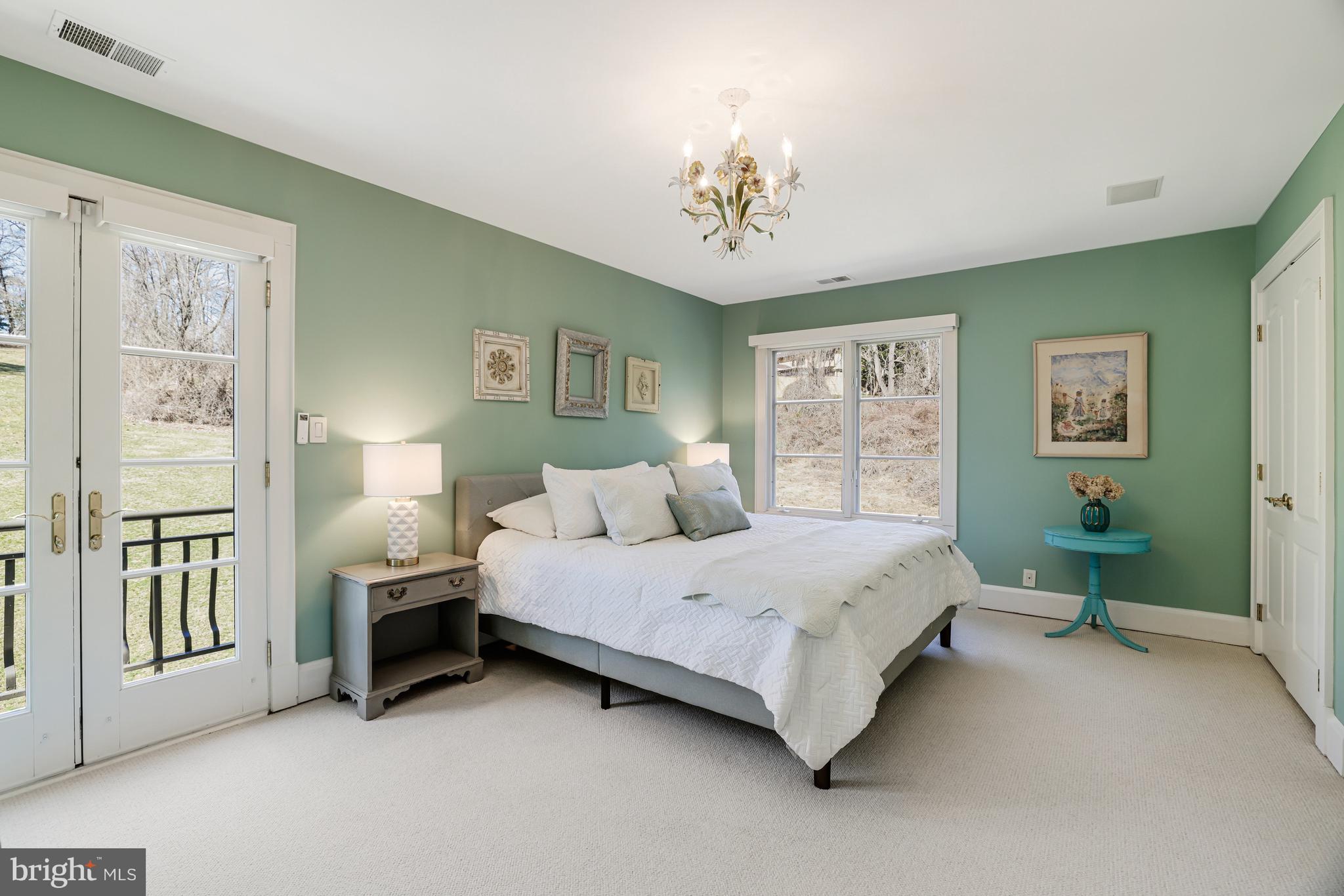 1127 Bellview Road McLean, VA 22102 - Photo 46 of 67 a spacious bedroom with a bed painting on wall and windows