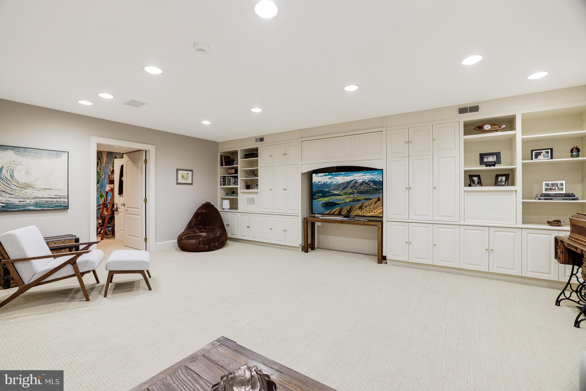1127 Bellview Road McLean, VA 22102 - Photo 49 of 67 a living room with furniture and a flat screen tv