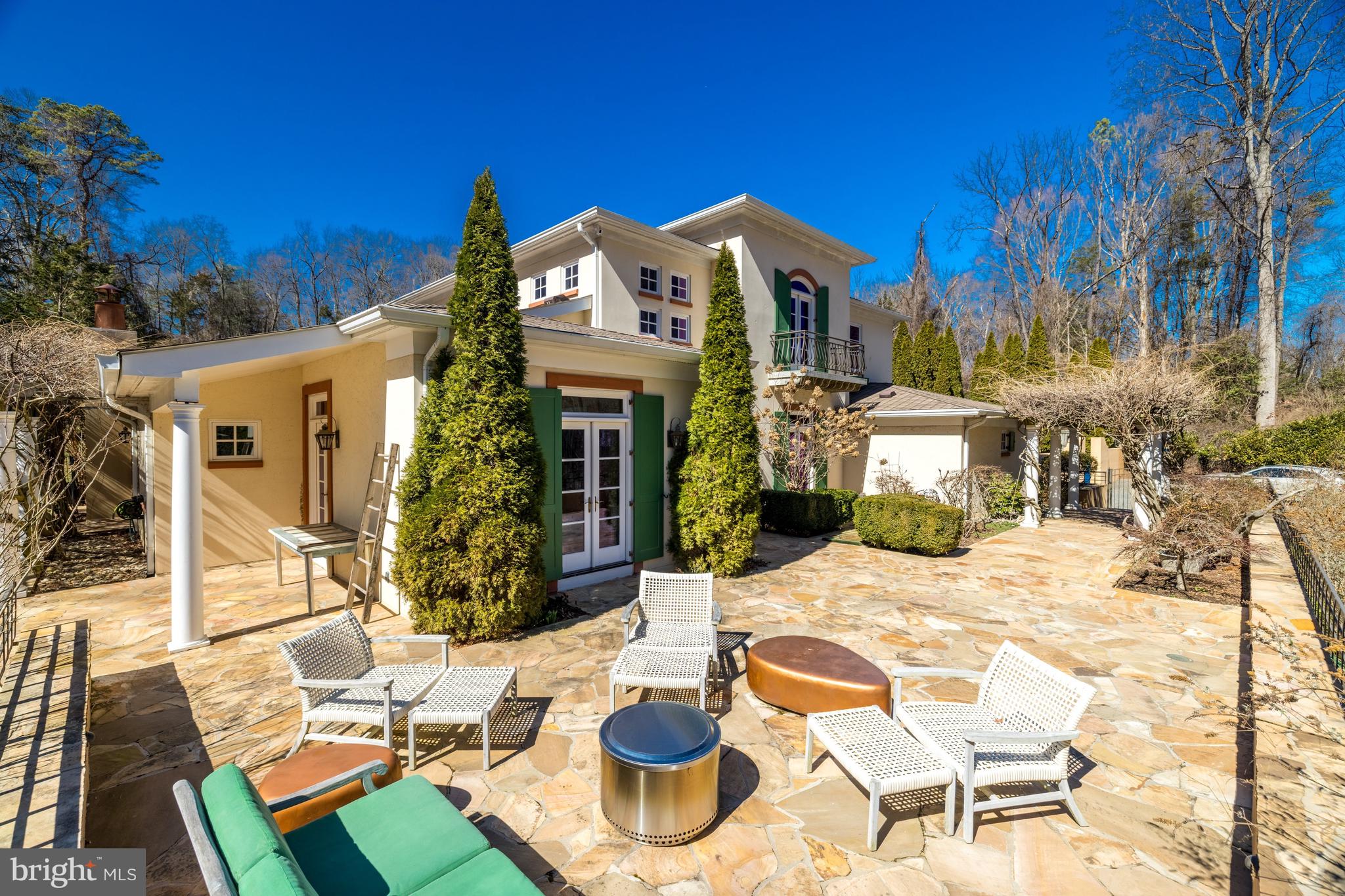 1127 Bellview Road McLean, VA 22102 - Photo 60 of 67 a view of a patio with couches table and chairs and potted plants