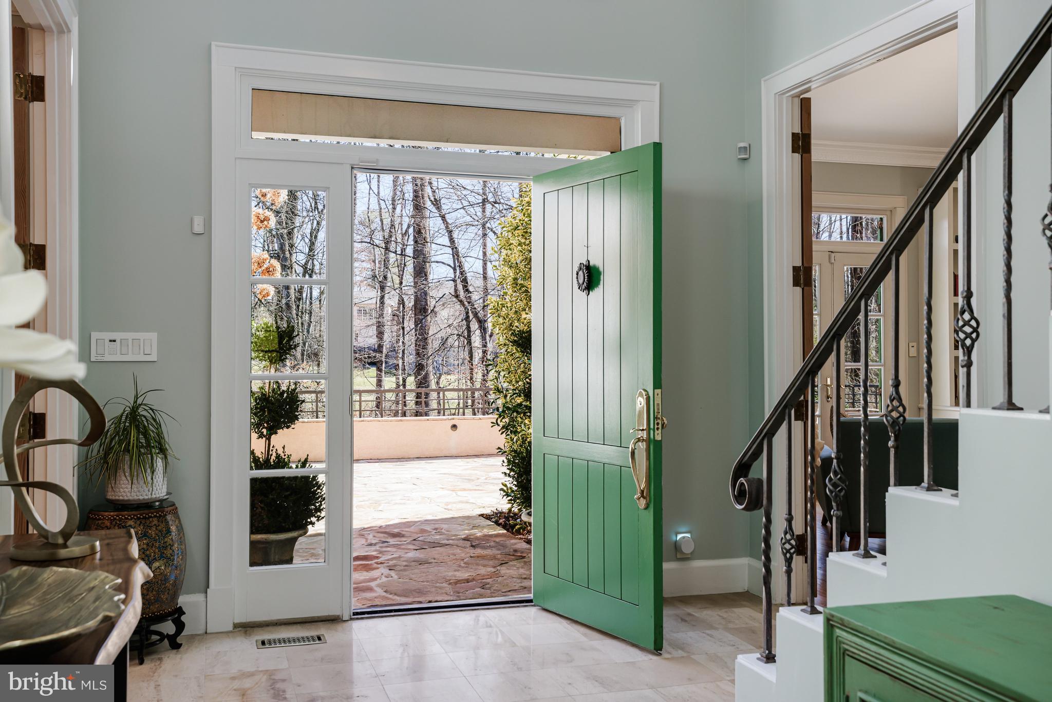 1127 Bellview Road McLean, VA 22102 - Photo 7 of 67 a view of an entryway with wooden floor and front door