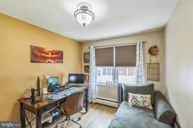 a workspace with furniture and a window