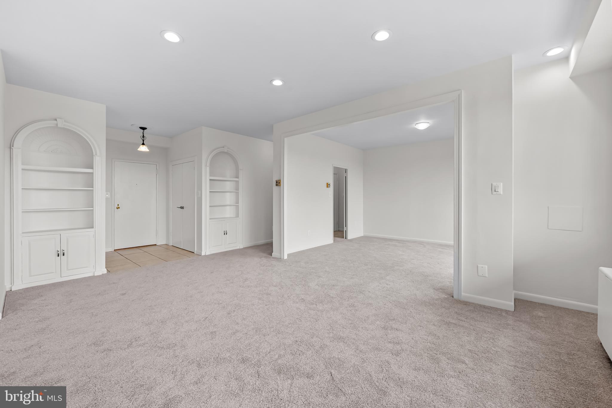 11 Slade Avenue, Unit 911 Baltimore, MD 21208 - Photo 6 of 32 an empty room with closet and a bathroom