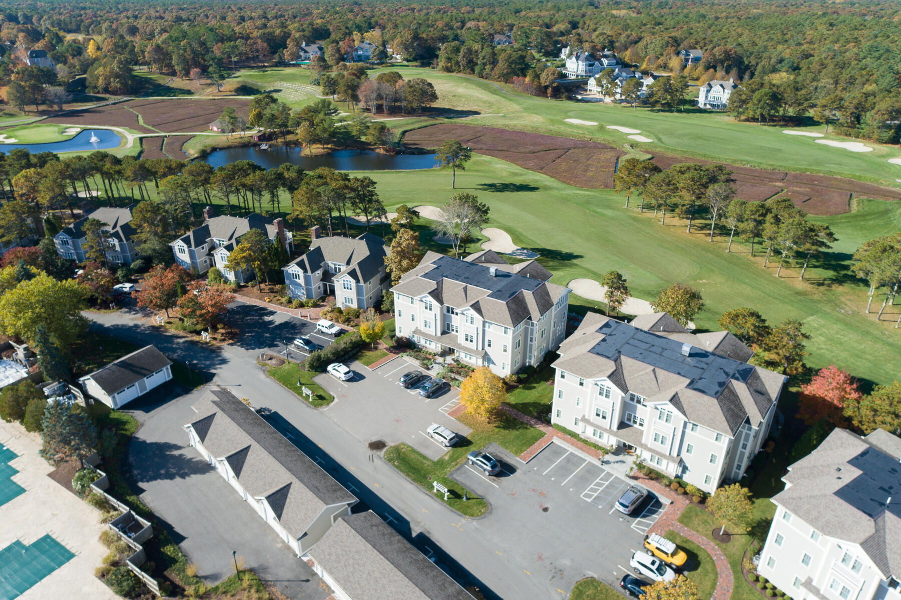 66 Simons Road, Unit F Mashpee, MA 02649 - Photo 2 of 26 an aerial view of a house with outdoor space