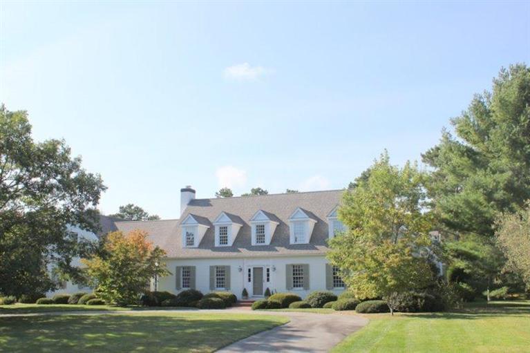 56 Farm Valley Road Osterville, MA 02655 - Photo 1 of 23 a front view of residential houses with yard and trees