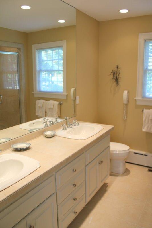 56 Farm Valley Road Osterville, MA 02655 - Photo 12 of 23 a bathroom with a sink a toilet and mirror