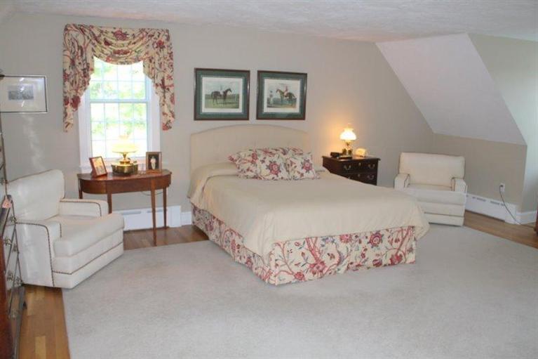 56 Farm Valley Road Osterville, MA 02655 - Photo 14 of 23 a bedroom with a bed and a couch