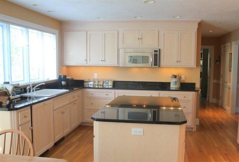 56 Farm Valley Road Osterville, MA 02655 - Photo 2 of 23 a kitchen with granite countertop a sink and a stove top oven