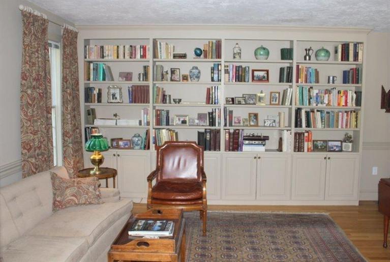 56 Farm Valley Road Osterville, MA 02655 - Photo 9 of 23 a living room with furniture and a book shelf
