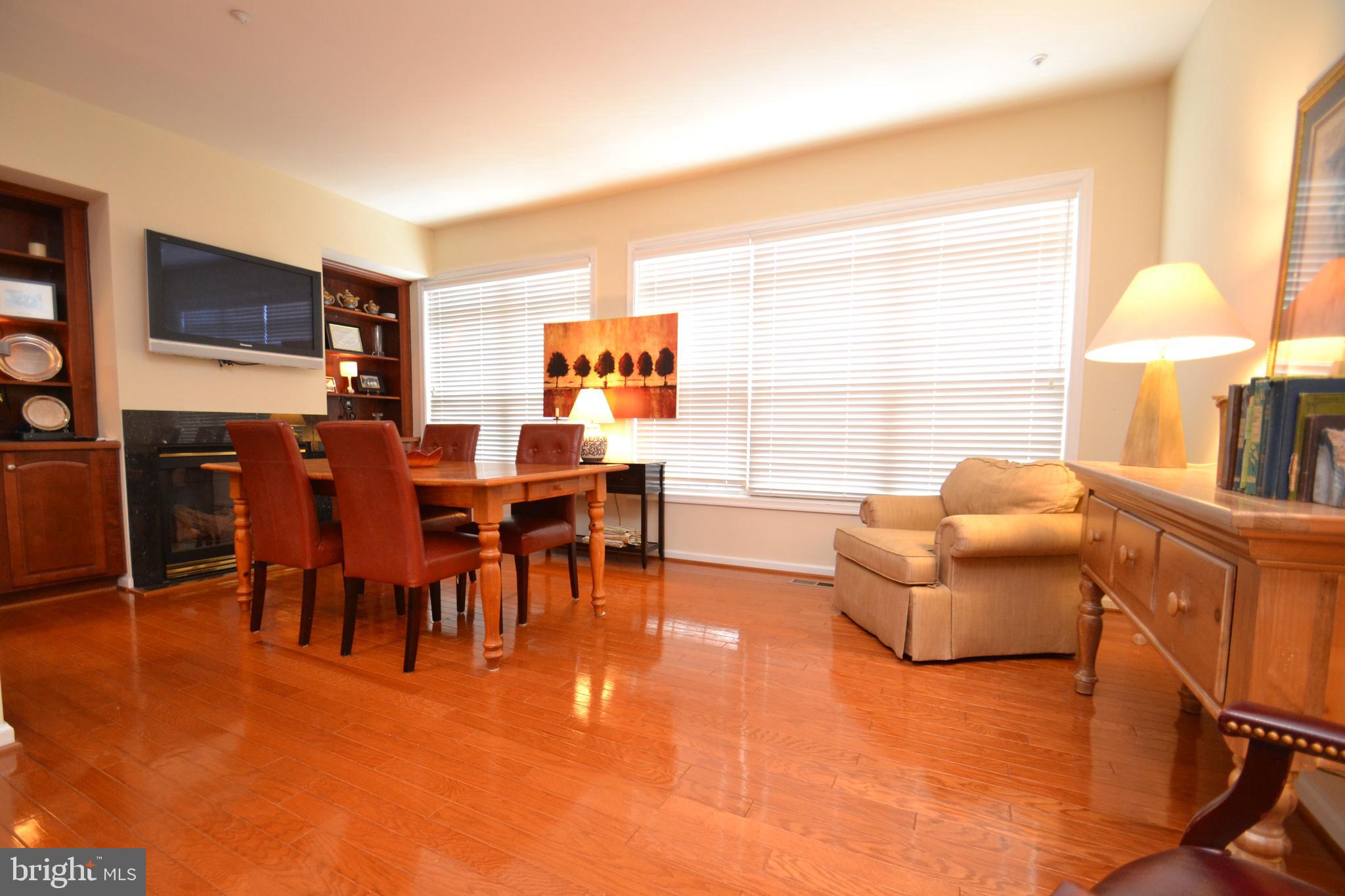 10207 Rutland Round Road, Unit 65 Columbia, MD 21044 - Photo 18 of 32 Dining w/wall of windows - lots of natural light