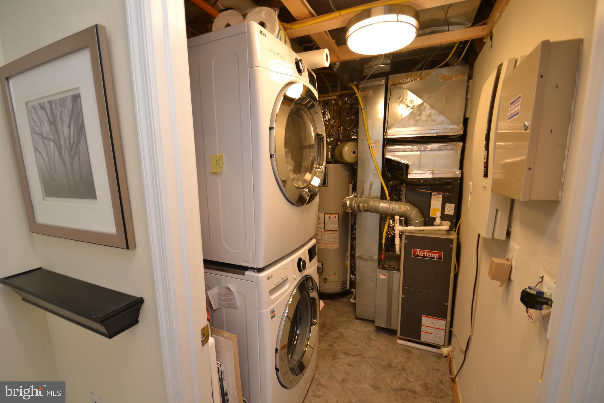 10207 Rutland Round Road, Unit 65 Columbia, MD 21044 - Photo 4 of 32 Entry level laundry and utility room