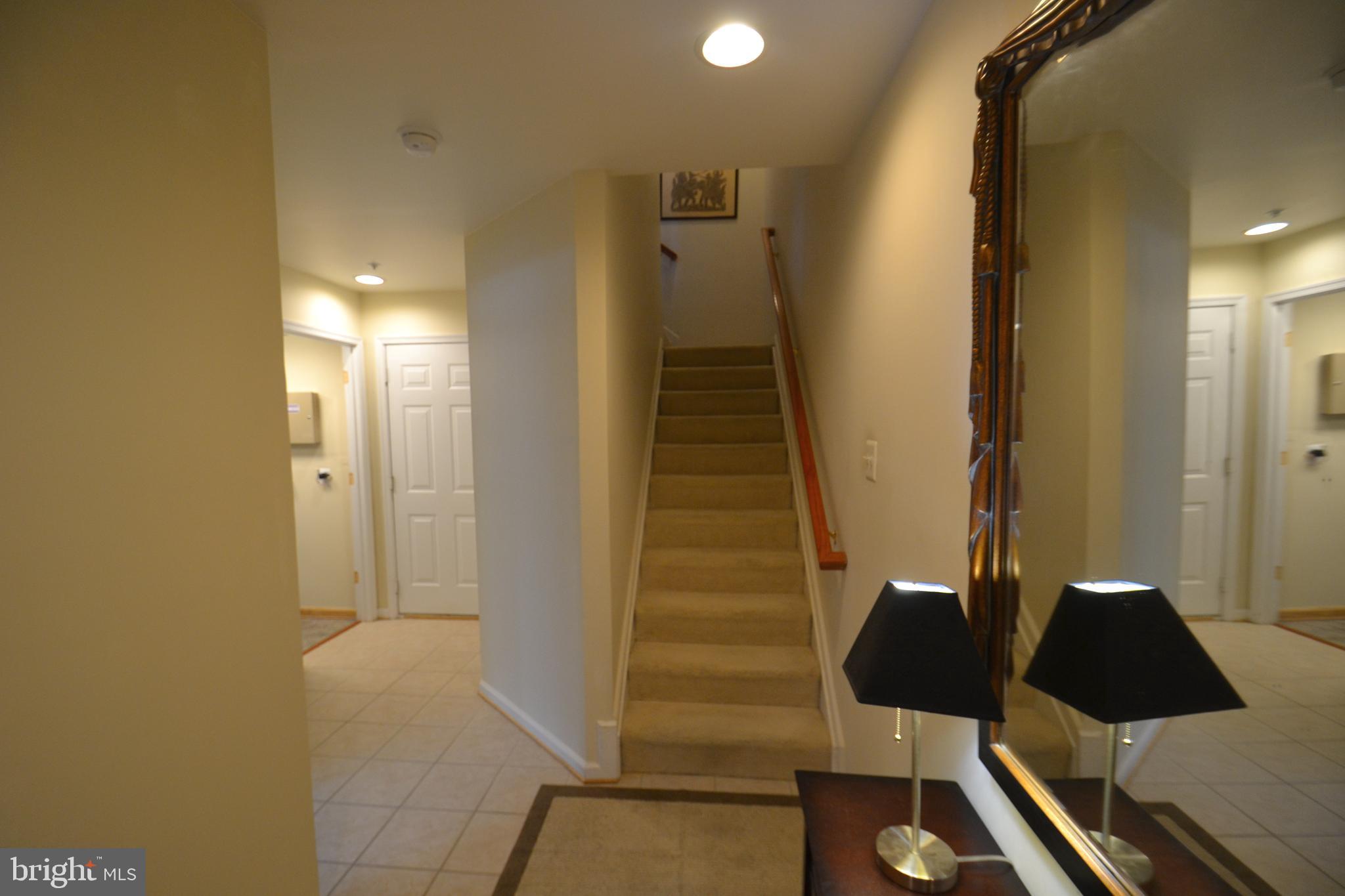 10207 Rutland Round Road, Unit 65 Columbia, MD 21044 - Photo 5 of 32 Entry level stairs to main level