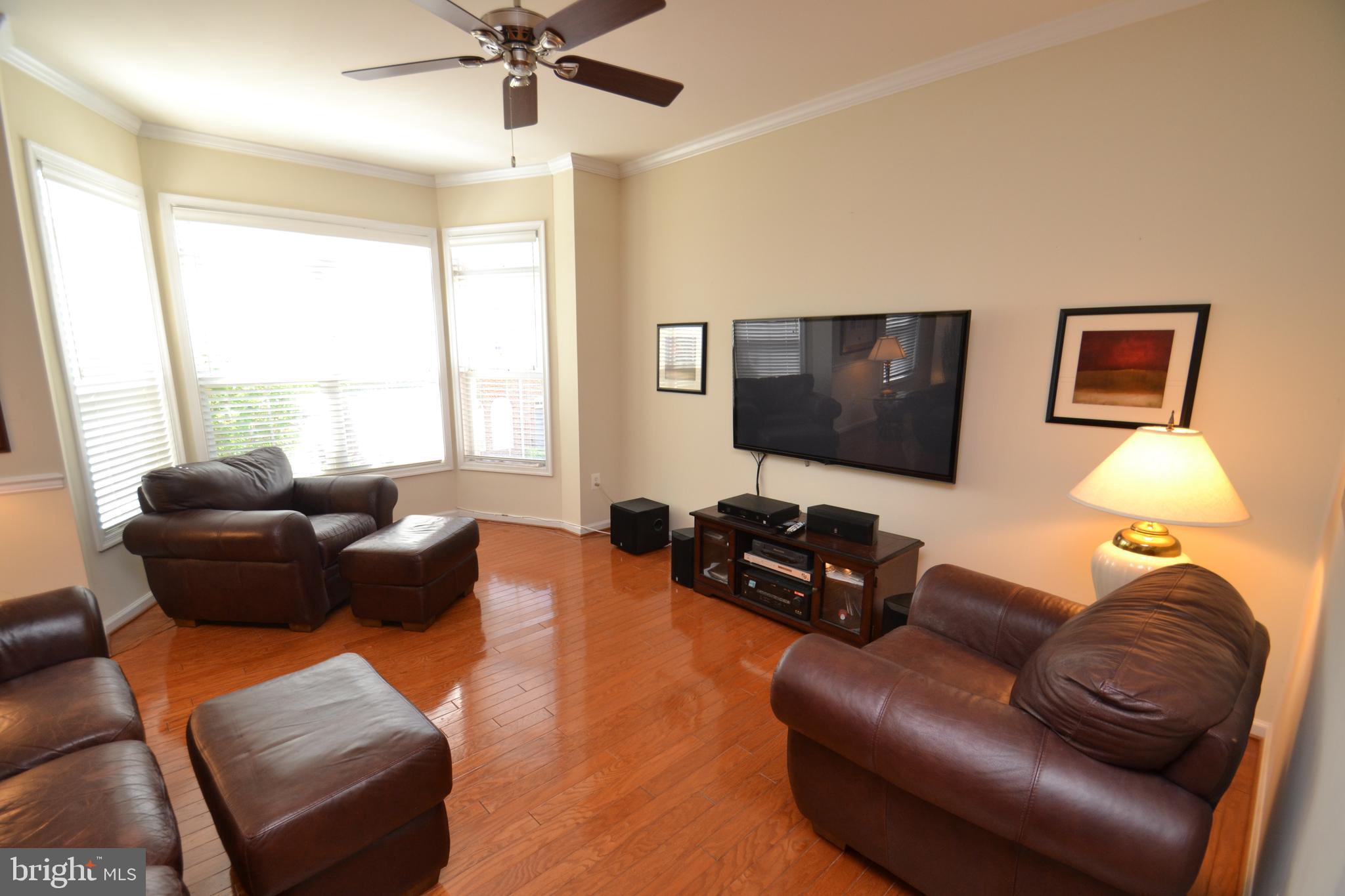 10207 Rutland Round Road, Unit 65 Columbia, MD 21044 - Photo 8 of 32 Main level family room with bay window