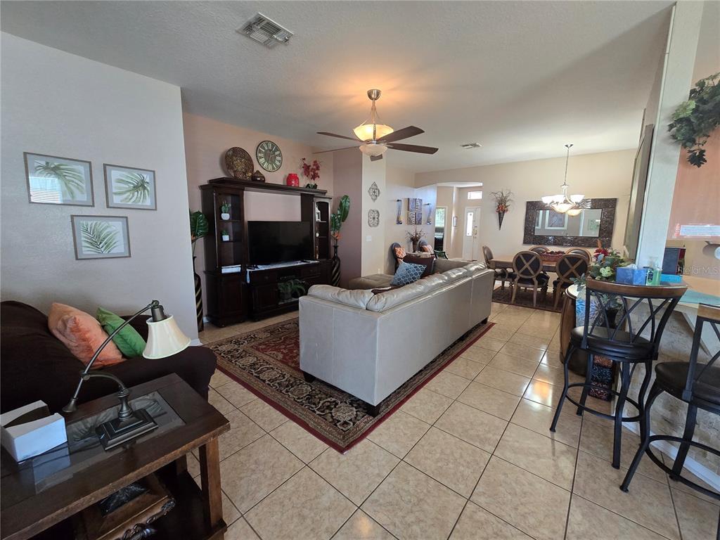 219 Cloverdale Road Winter Haven, FL 33884 - Photo 12 of 29 a living room with furniture and a wooden floor