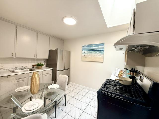 135 Bepler Street Daly City, CA 94014 - Photo 12 of 34 a kitchen with a stove a refrigerator and a stove