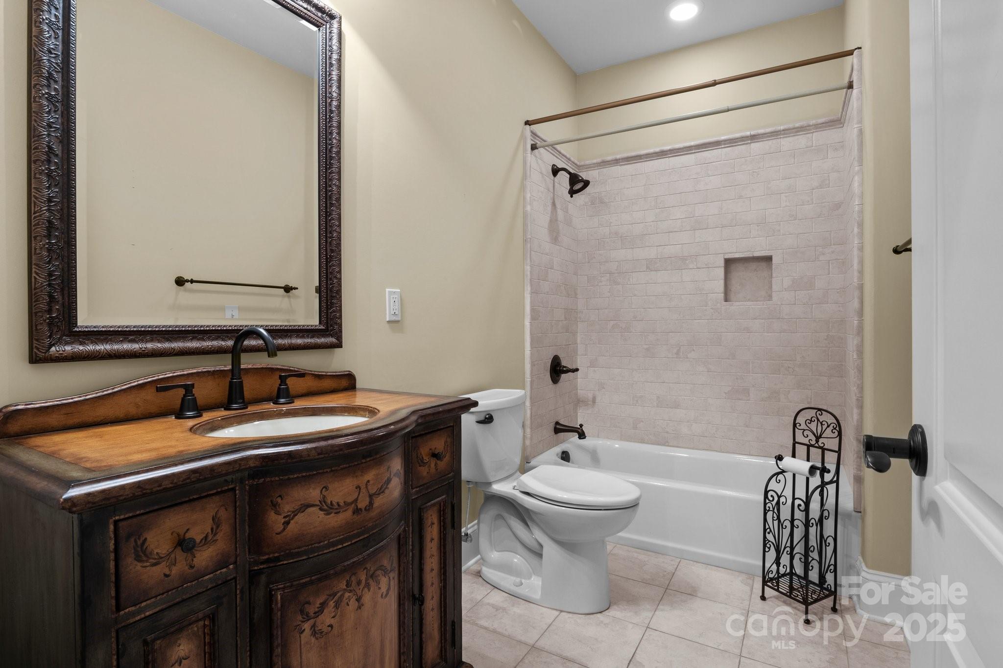 8034 Bay Pointe Drive Denver, NC 28037 - Photo 17 of 45 a bathroom with a sink and a mirror