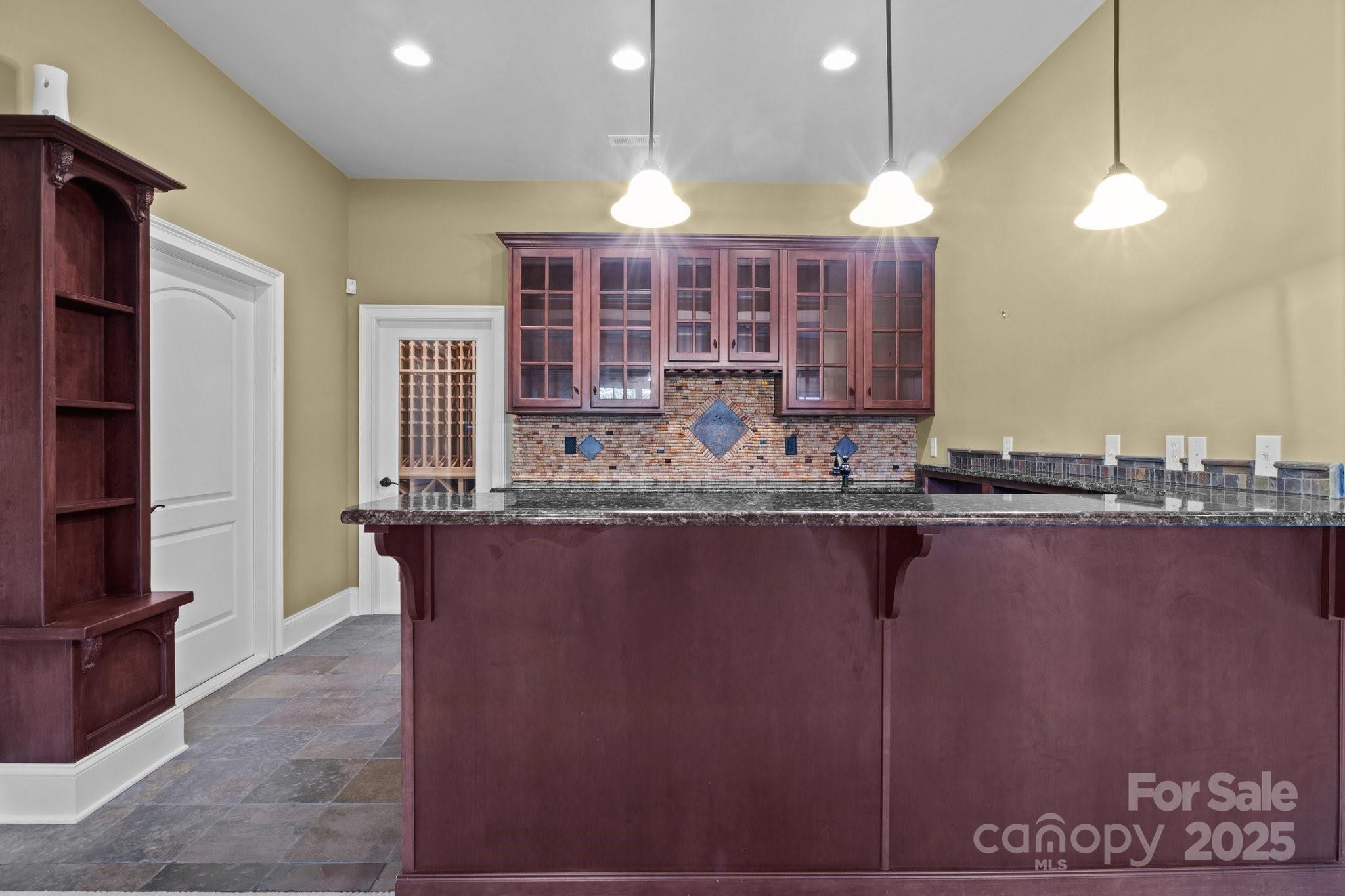 8034 Bay Pointe Drive Denver, NC 28037 - Photo 18 of 45 a kitchen with a table and chairs in it