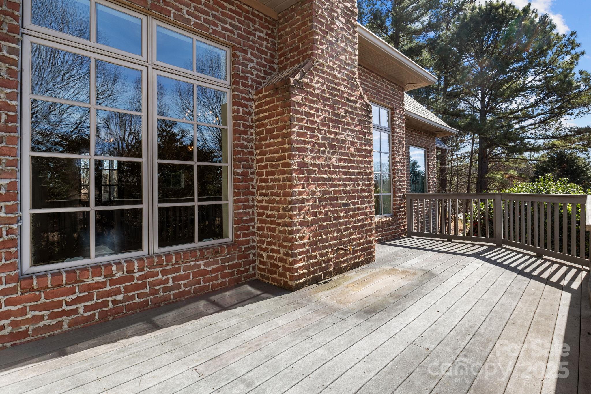8034 Bay Pointe Drive Denver, NC 28037 - Photo 25 of 45 a view of a brick house with a large window