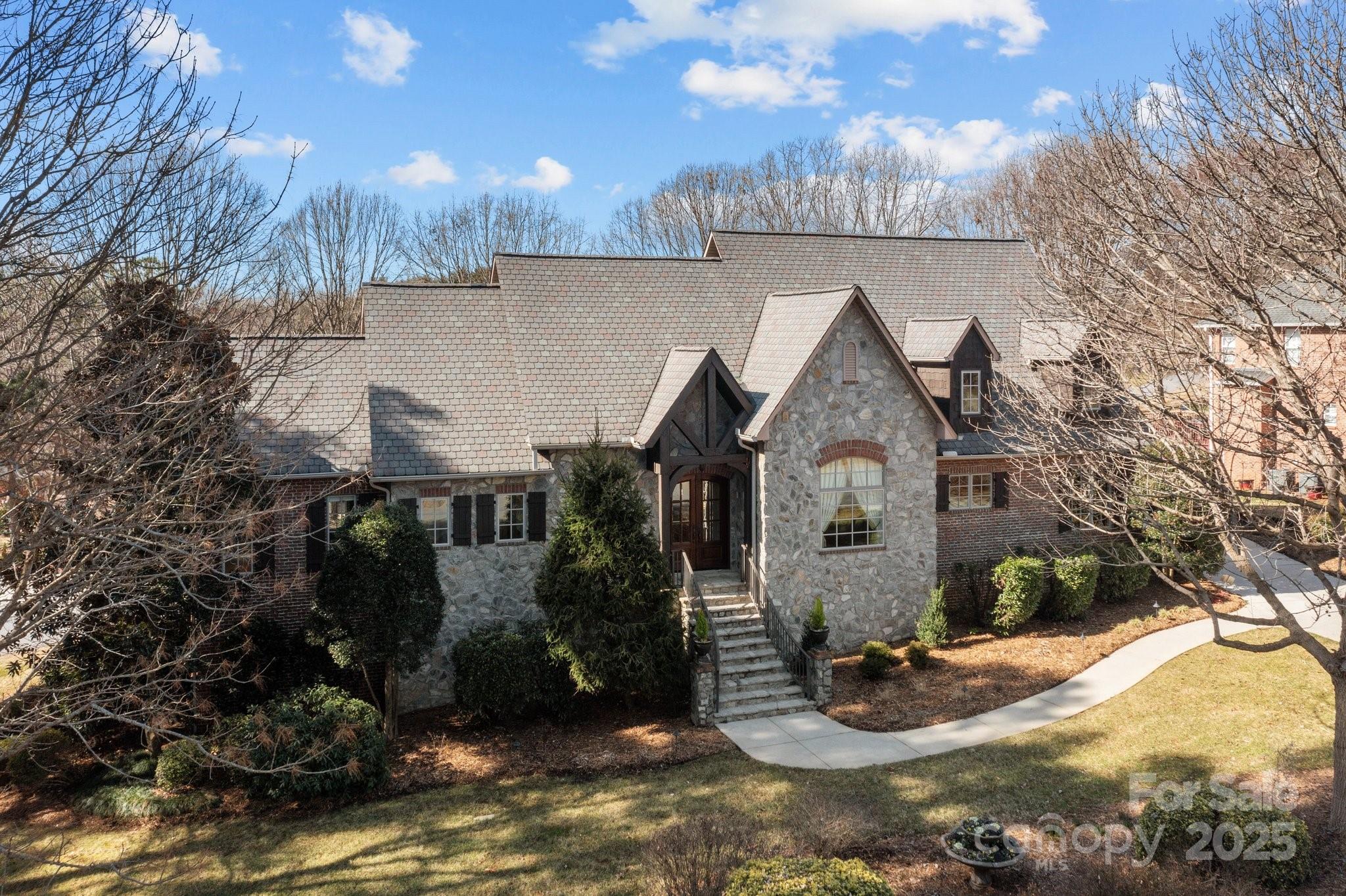 8034 Bay Pointe Drive Denver, NC 28037 - Photo 28 of 45 a front view of a house with a yard and garage