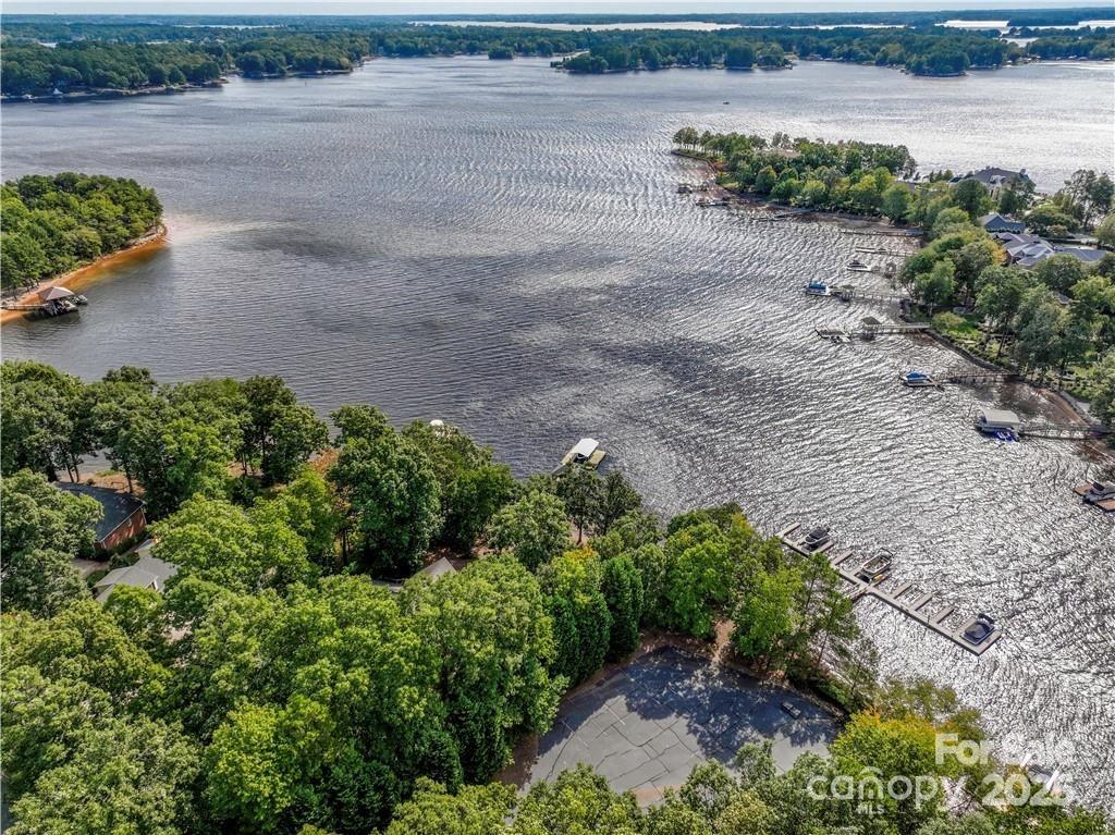 8034 Bay Pointe Drive Denver, NC 28037 - Photo 33 of 45 a view of a lake with beach and outdoor space