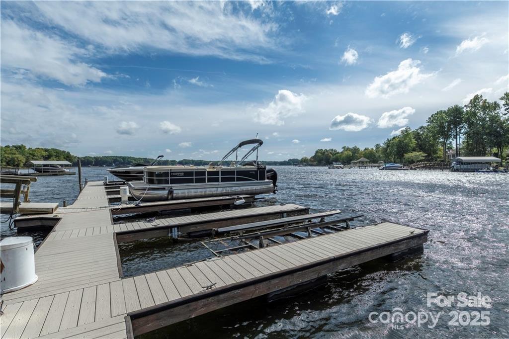 8034 Bay Pointe Drive Denver, NC 28037 - Photo 34 of 45 a view of a roof deck with wooden floor and city view