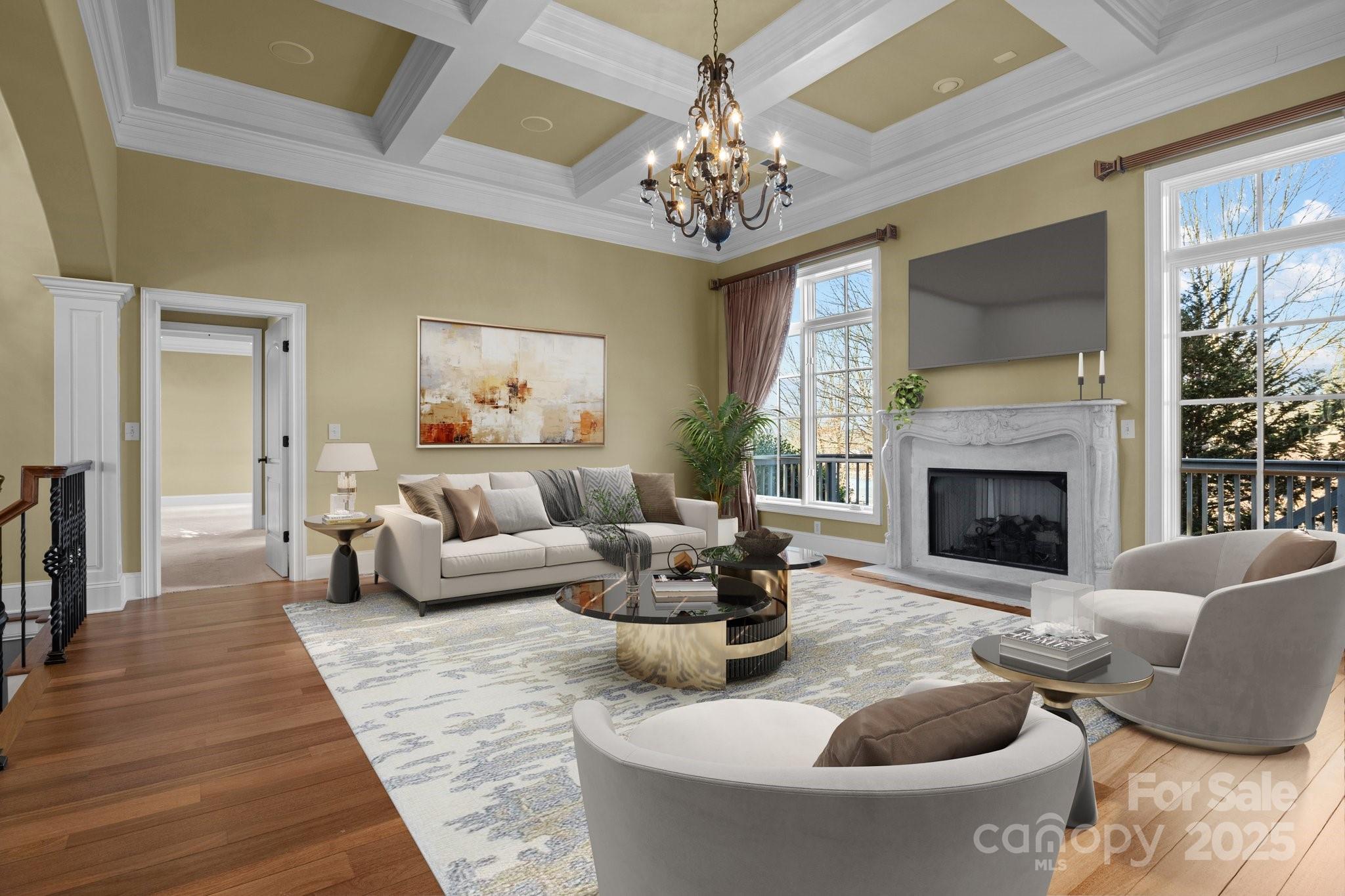 8034 Bay Pointe Drive Denver, NC 28037 - Photo 5 of 45 a living room with furniture a chandelier and a fireplace