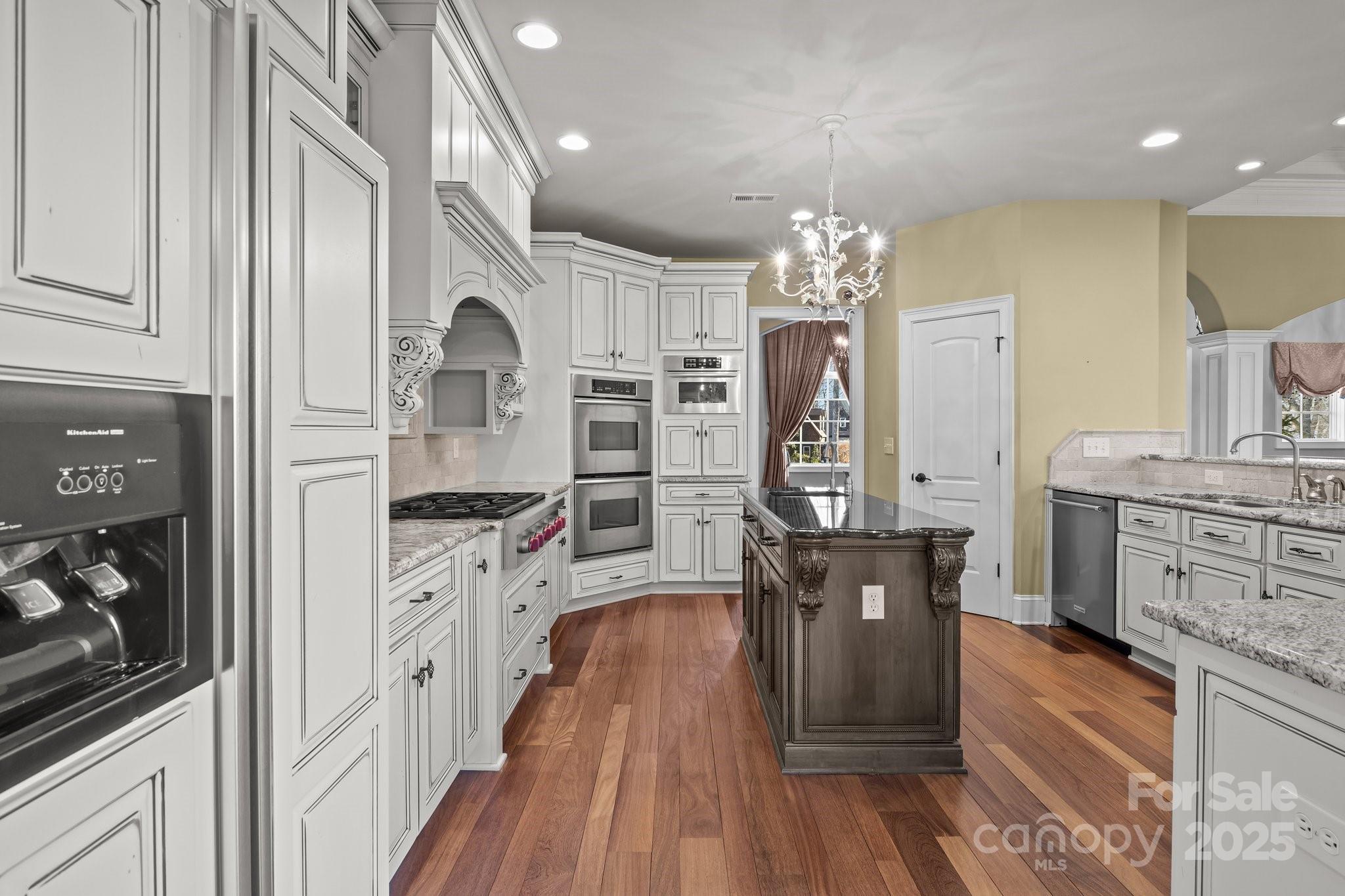 8034 Bay Pointe Drive Denver, NC 28037 - Photo 6 of 45 a very nice looking room with wooden floor and furniture