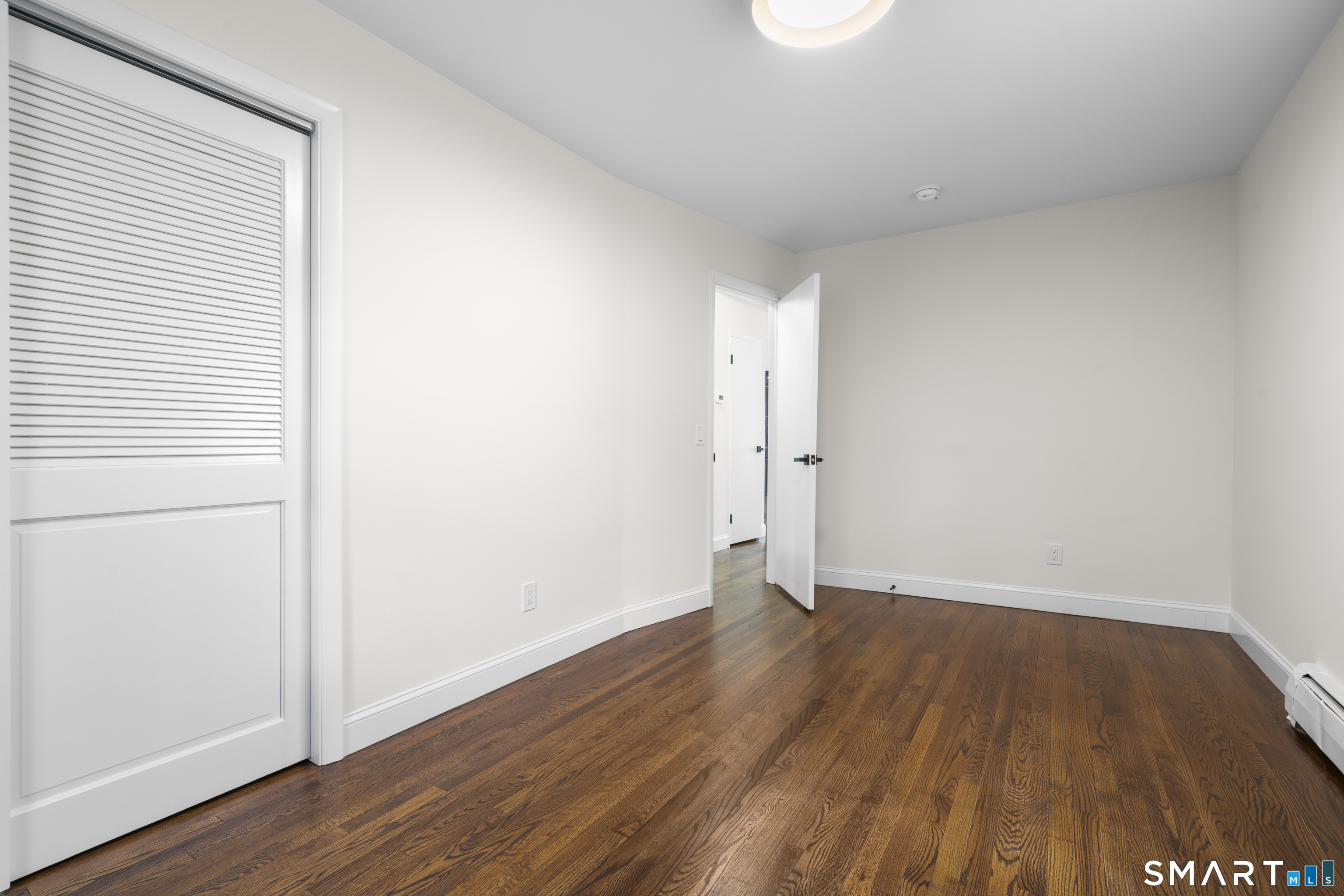 70 Dayton Road Redding, CT 06896 - Photo 14 of 38 a view of an empty room with wooden floor