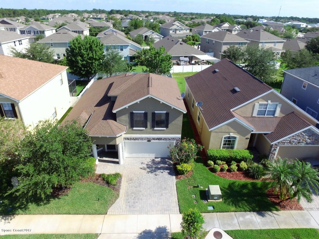 1202 Becket Place Melbourne, FL 32940 - Photo 2 of 38 an aerial view of a house with a yard