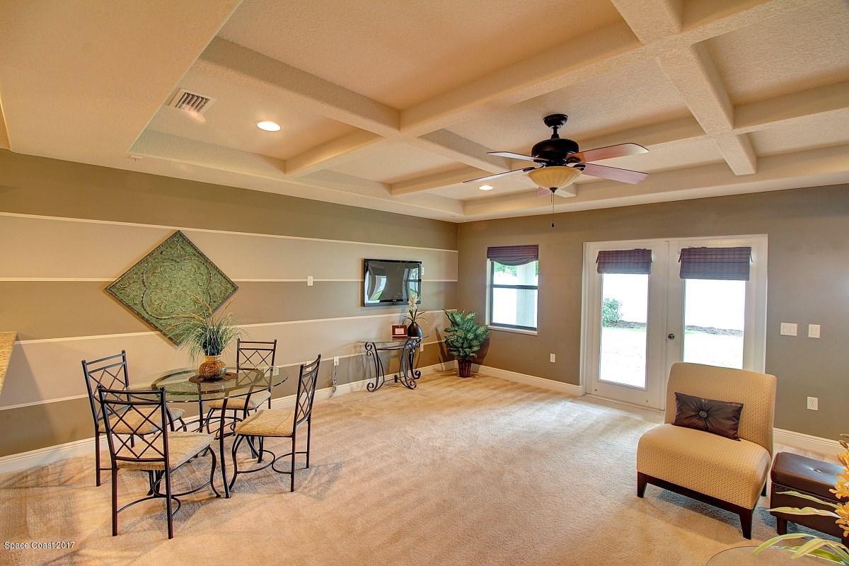 1202 Becket Place Melbourne, FL 32940 - Photo 12 of 38 a view of a livingroom with furniture and a ceiling fan