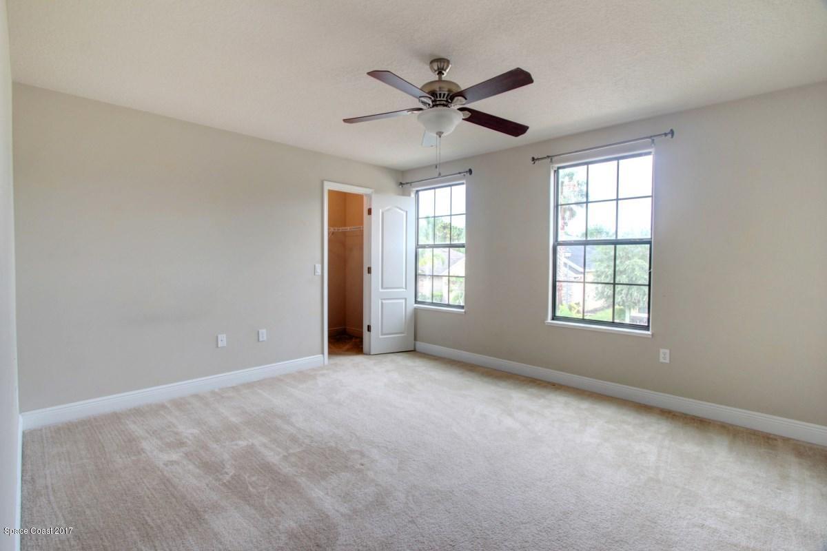 1202 Becket Place Melbourne, FL 32940 - Photo 22 of 38 a view of an empty room with a window