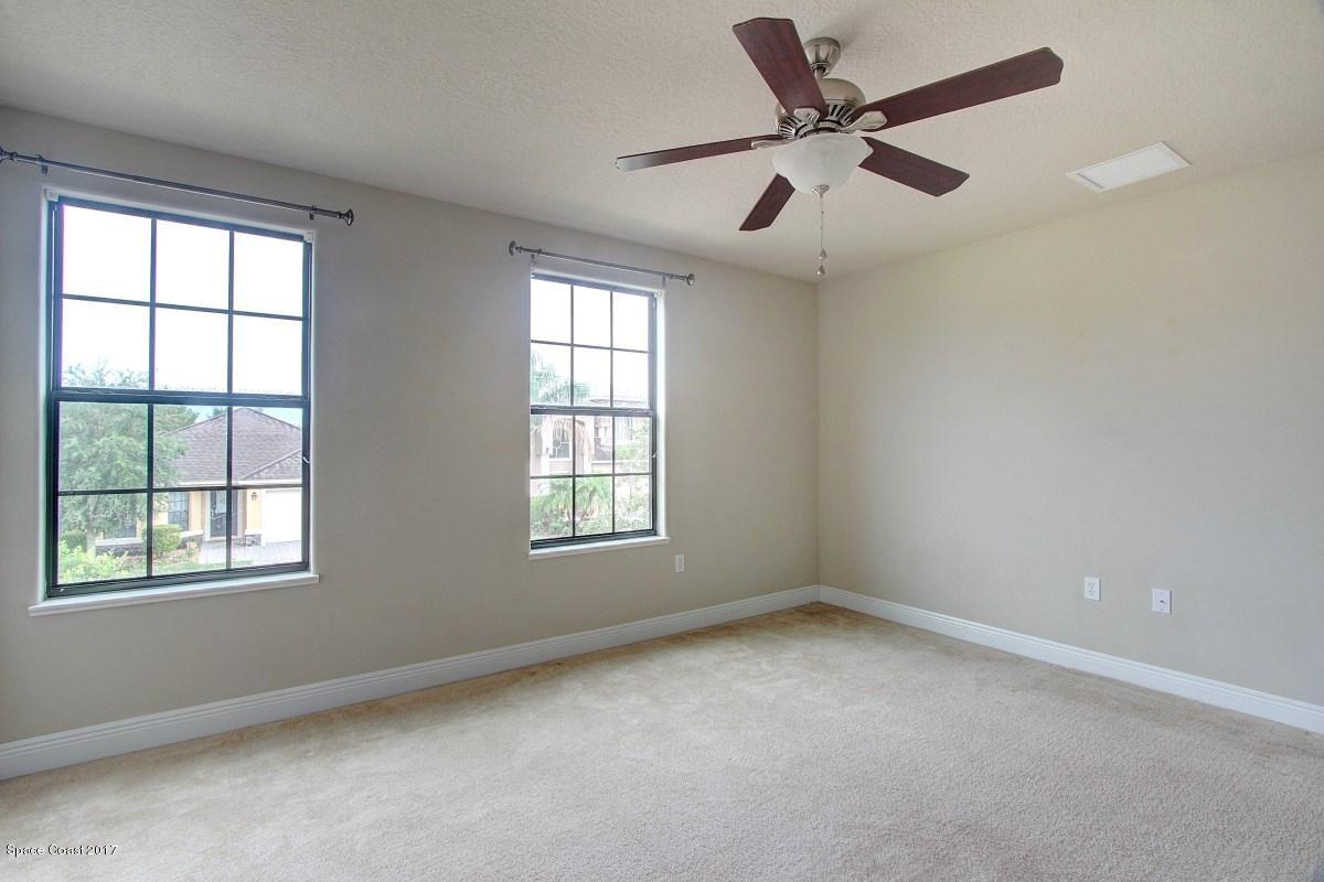1202 Becket Place Melbourne, FL 32940 - Photo 23 of 38 a view of an empty room with a window