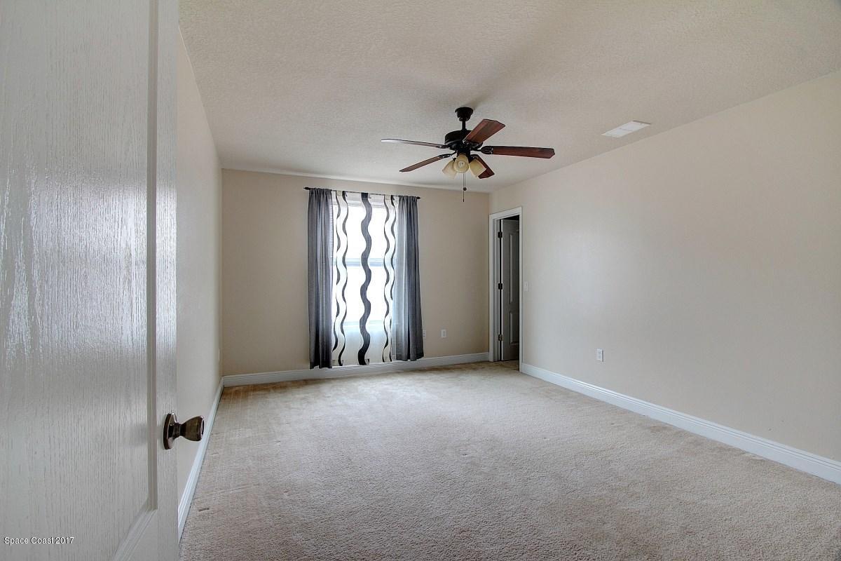 1202 Becket Place Melbourne, FL 32940 - Photo 25 of 38 a view of empty room with windows