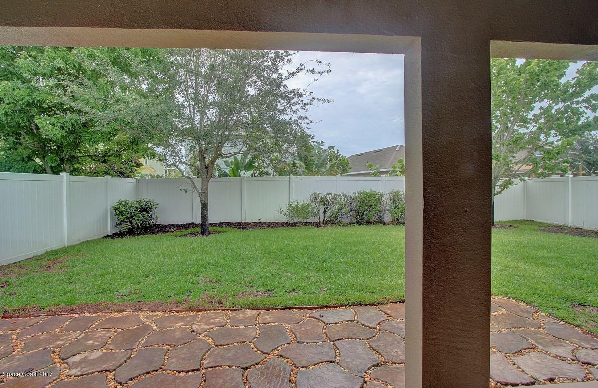 1202 Becket Place Melbourne, FL 32940 - Photo 29 of 38 a view of a back yard from a room
