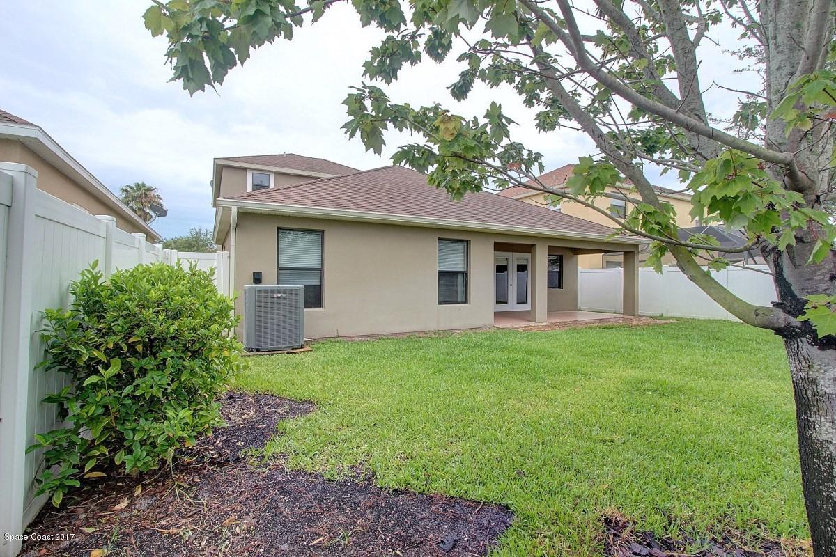 1202 Becket Place Melbourne, FL 32940 - Photo 30 of 38 a view of a house with backyard and garden