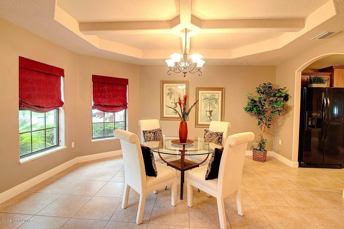 1202 Becket Place Melbourne, FL 32940 - Photo 4 of 38 a view of a dining room with furniture and window