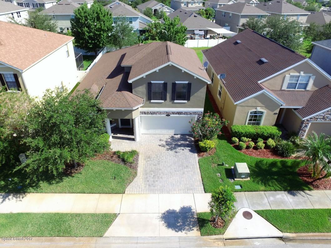 1202 Becket Place Melbourne, FL 32940 - Photo 36 of 38 an aerial view of a house with a yard