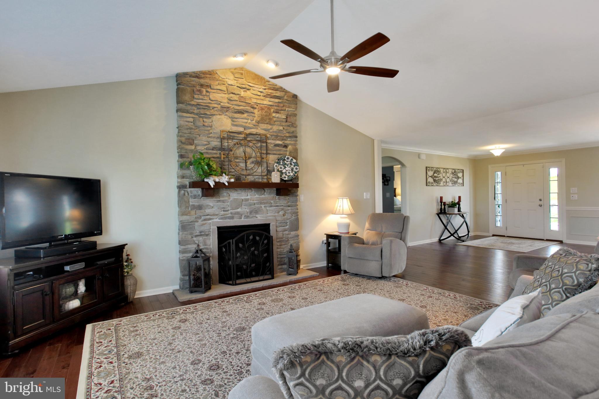7046 Beaver Spring Road Harrisburg, PA 17111 - Photo 13 of 52 Focal point of floor to ceiling stone fireplace