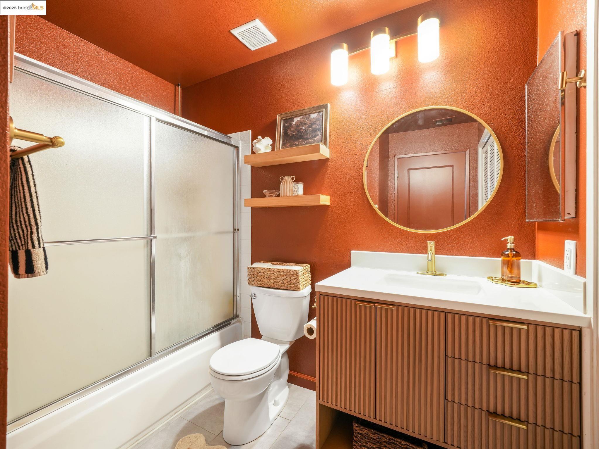 806 Devonwood Hercules, CA 94547 - Photo 15 of 24 a bathroom with a sink a toilet and a mirror