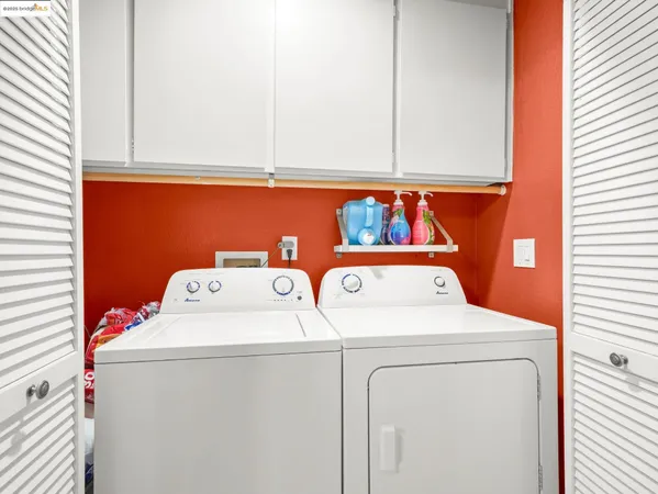 a bedroom with a bed couch and window