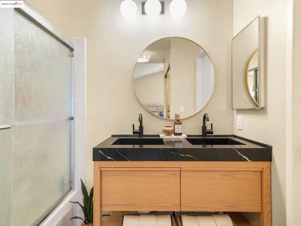 a close view of a sink and a mirror in the bathroom