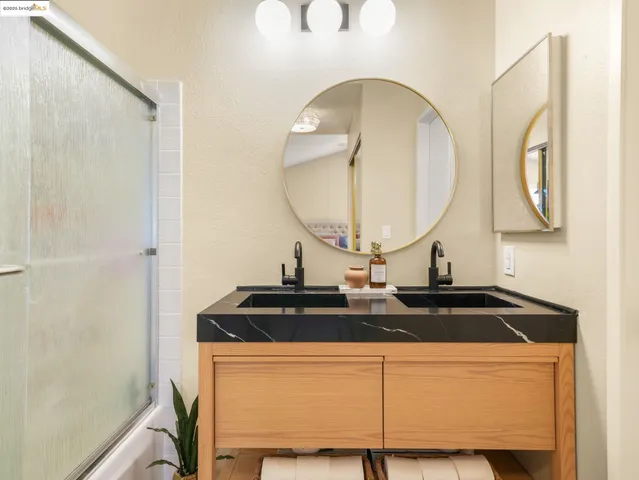 a close view of a sink and a mirror in the bathroom