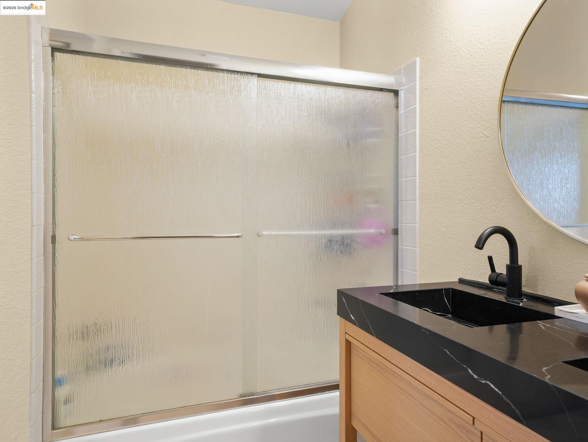 806 Devonwood Hercules, CA 94547 - Photo 22 of 24 a close view of a sink and a mirror in the bathroom