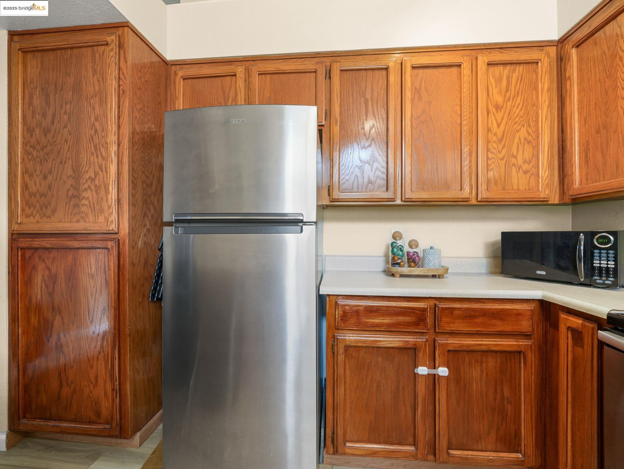 806 Devonwood Hercules, CA 94547 - Photo 7 of 24 a white refrigerator freezer sitting in a kitchen