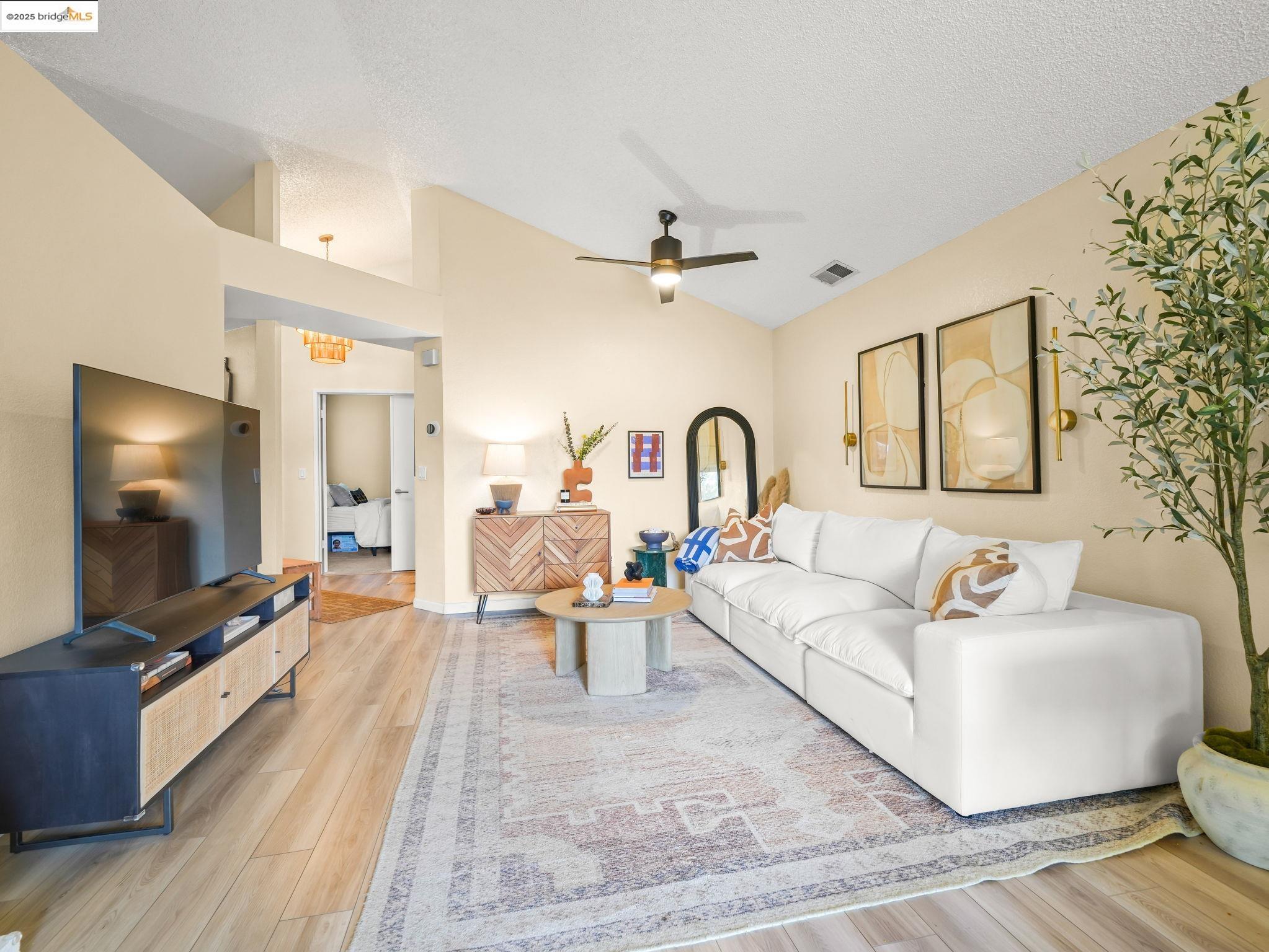 806 Devonwood Hercules, CA 94547 - Photo 9 of 24 a living room with furniture and a flat screen tv